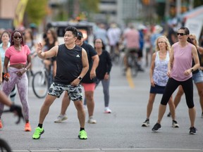 A Zumba class is held in the intersection of Ouellette and University Avenue during Open Streets Windsor, on Sunday, Sept. 18, 2022.