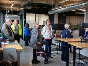 A group is guided through the Glos Arch+Eng offices at the newly restored Walker Power Building during Open Doors Windsor, on Saturday, Sept. 24, 2022.