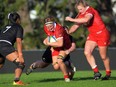 Canada's Tyson Beukeboom (centre) in action during the 2022 Pacific Four Women's Rugby Series rugby match between NZ Black Ferns and Canada at Trusts Stadium in Auckland, New Zealand on Sunday, June 12, 2022. Beukeboom celebrated her 50th cap with a try off the bench as Canada defeated Fiji 24-7 Friday in its final test match ahead of next month's Women's Rugby World Cup.