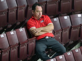 Windsor Spitfires' general manager Bill Bowler keeps an eye on the action during training camp.