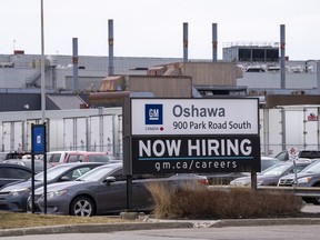 A sign announcing hiring is shown at the General Motors facility in Oshawa, Ontario on Monday April 4, 2022. Statistics Canada says the number of job vacancies in the country moved lower to slip below one million in July, but remained well above where they were a year earlier.