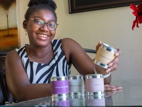 'Something I love.' Tess Ogunjinmi, 17, owner of Serene is pictured with the candles she is selling on Thursday September 1st, 2022.