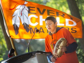 Mgiizi Wright performs a hymn for all the children who died at the residential schools, during a community gathering at the Ojibway Prairie Complex to mark the National Day of Truth and Reconciliation, on Friday, Sept. 30, 2022.