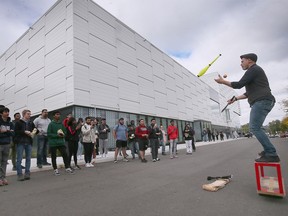 University of Windsor students watch a performance by busker Kobbler Jay during a campus community BBQ event at the Toldo Lancer Centre on Wednesday, September 28, 2022.