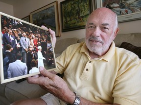 Retired photographer Vern Harvey poses with a photo on Tuesday, September 13, 2022, taken in 1984 during Queen Elizabeth II's visit to Windsor where he met Her Majesty. Harvey took an official photo for the City of Windsor that was presented to the Queen.