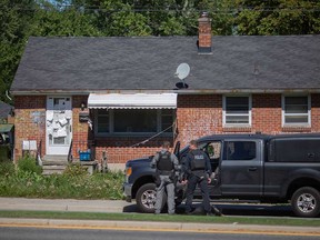 Windsor police surround a home at 4340 Wyandotte St. East on Sept. 8, 2022.
