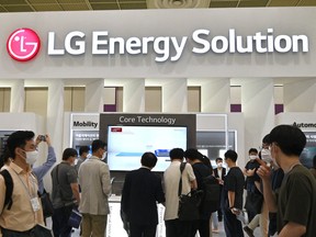 Visitors look at a booth of LG Energy Solution during the InterBattery 2021 exhibition at COEX in Seoul on June 11, 2021.