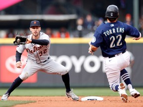 Ryan Kreidler of the Detroit Tigers turns a double play against Luis Torrens of the Seattle Mariners during the eighth inning of the game at T-Mobile Park on October 05, 2022 in Seattle, Washington.