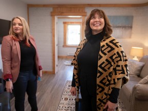 Krista Rempel, Executive Director at the Bridge Youth Resource Centre, is joined by Fiona Coughlin, left, Executive Director and CEO, Habitat for Humanity Windsor-Essex as she gets a first look at the multi-unit 3D printed home donated to the centre by the Habitat for Humanity, on Sherk Street in Leamington on Thursday, Oct. 27, 2022.