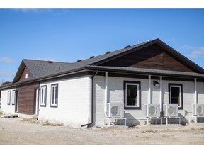 The exterior of a multi-unit 3D printed home donated to the Bridge Youth Resource Centre by the Habitat for Humanity Windsor-Essex, on Sherk Street in Leamington on Thursday, Oct. 27, 2022.