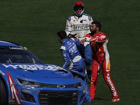 Bubba Wallace confronts Kyle Larson after an on-track incident during the NASCAR Cup Series South Point 400 at Las Vegas Motor Speedway on October 16, 2022 in Las Vegas, Nevada.