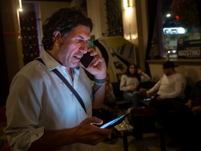 Ward 3 candidate, Renaldo Agostino, checks the incoming results of the 2022 municipal election while at Turbo Espresso Bar, on Monday, Oct. 24, 2022.