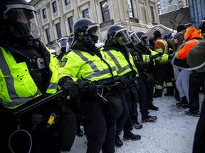 Police from different forces across the country joined together to try to bring the “Freedom Convoy” occupation in Ottawa to an end, Feb. 19, 2022.