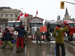 Protesters from the "Freedom Convoy" in front of Parliament Hill during a demonstration in Ottawa, Ontario, Canada, on Thursday, Feb. 3, 2022.