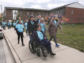 Participants in the first annual Ambassadors Walk For Hunger are shown on Saturday, October 15, 2022, on Drouillard Avenue in Windsor.