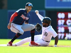 Detroit Tigers left fielder Akil Baddoo (right) beats the throw to Minnesota Twins shortstop Carol Correa to steal second base in the first inning at Comerica Park.