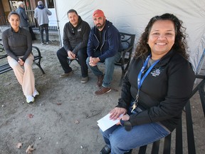 Rukshini Ponniah-Goulin, right, executive director of the Downtown Mission is shown with Natalie Bourgoin, Abram Banman and Greg Lemay on Thursday, October 27, 2022 in front of the organization's Ouellette Avenue location. Ponniah-Goulin was hosting a 50th Anniversary 24-hour Bench Talks Event to celebrate the Mission's 50th anniversary.