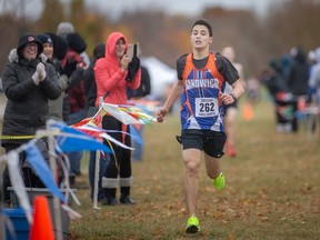 The Sandwich Sabres' Andreas Pardalis crosses the finish line in second place in the senior boy's 6km race at the SWOSSAA cross-country championships at Malden Park.