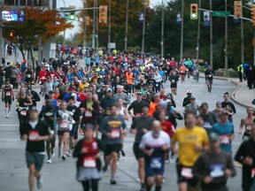 Detroit Free Press marathon runners are shown along Riverside Drive West in downtown Windsor on Sunday, October 16, 2022.