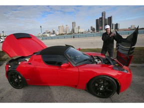 WINDSOR, ONTARIO. OCTOBER 8, 2022 -  Patrick Pinsonneault of Chatham is shown in downtown Windsor on Saturday, October 8, 2022. Pinsonneault, also know as Mr. Tesla Canada participated in the filming of a documentary on electric powered vehicles. He is shown with his Tesla Roadster.