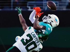 Oct 9, 2022; East Rutherford, N.J., USA; New York Jets cornerback Michael Carter II (30) is called for pass interference while defending Miami Dolphins wide receiver Jaylen Waddle (17) at MetLife Stadium.