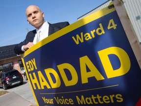 Windsor Ward 4 candidate Edy Haddad, shown Friday, Oct. 14, 2022, with one of his campaign signs, said he's lost many of them to vandalism and has asked police to investigate.