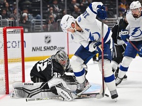 Los Angeles Kings goaltender Jonathan Quick defends a shot on goal by Tampa Bay Lightning right wing Corey Perry at Crypto.com Arena.