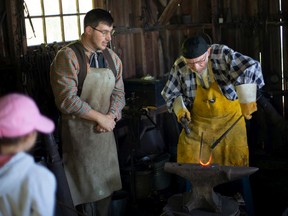 Julis Langpeter puts on a blacksmith demonstration at the Harvest and Horses Festival at the John R. Park Homestead, on Sunday, Oct. 2, 2022.