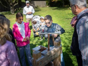 Kids learn how to make apple cider at the Harvest and Horses Festival at the John R. Park Homestead, on Sunday, Oct.  2, 2022.