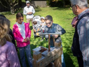 Kids learn how to make apple cider at the Harvest and Horses Festival at the John R. Park Homestead, on Sunday, Oct. 2, 2022.