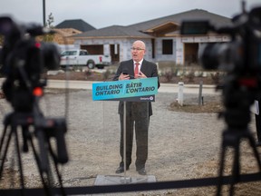 Steve Clark, Minister of municipal affairs and housing, speaks during a press event discussing the housing affordability action plan, while at a housing construction site on Lilymac Boulevard, in South Windsor, on Thursday, Oct. 20, 2022.