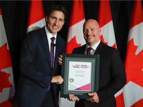 Butch Rickeard receives the Prime Minister's Award for Teaching Excellence from Prime Minister Justin Trudeau at a ceremony in Ottawa on October 3, 2022.