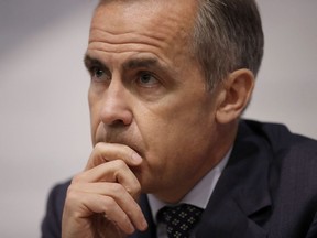 Mark Carney, then-governor of the Bank of England, listens to a journalist's question during a Financial Stability Report press conference at the Bank of England in the City of London, Thursday, July 11, 2019.&ampnbsp;Carney, a former governor of the Bank of Canada, says a global recession is likely, making it difficult for Canada to avoid the economic downturn.