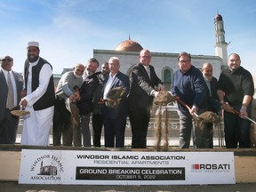 The Windsor Islamic Association Foundation held a ground breaking ceremony on Wednesday, Oct. 5, 2022, for a residential development in South Windsor. Dignitaries participate in the ceremonial ground breaking.