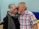 Mayor Hilda MacDonald gets a victory kiss from husband Doug MacDonald.
