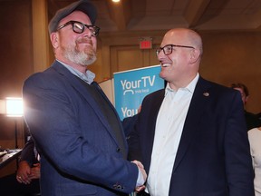 Chris Holt, left, who finished second in the Windsor mayoral race congratulates winner Drew Dilkens on Monday, October 24, 2022 at the Fogolar Furlan Club.