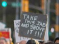 A demonstrator's sign during a protest in Windsor in October 2021.