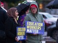 Education workers rally outside the Greater Essex County District School Board office in downtown Windsor to bring attention to support staff shortages on Tuesday, Oct. 18, 2022.