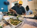 Anthony Nelson, manager at Street Help, prepares a Thanksgiving meal on Sunday, October 9, 2022. The organization handed out hundreds of meals over the weekend.