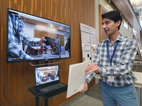 Arash Rocky, an engineering student at the University of Windsor, explains computer vision concepts on Friday, Oct. 14, 2022, during a research open house at the institution.