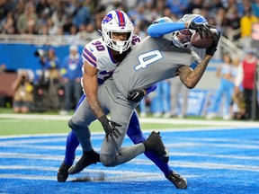 DJ Chark #4 of the Detroit Lions catches a pass for a touchdown against Dane Jackson #30 of the Buffalo Bills during the fourth quarter at Ford Field on Nov. 24, 2022 in Detroit.
