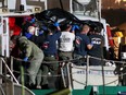 Rescue personnel return to shore with the victims of a pre-dawn fire that sank a commercial diving boat off the coast of Santa Barbara, Calif., in this file photo taken Sept. 2, 2019.