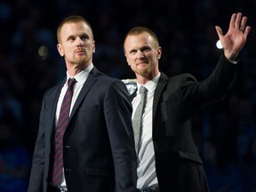 Henrik and Daniel Sedin have their jerseys retired before a game between the Vancouver Canucks and Chicago Blackhawks at Rogers Arena in Vancouver, Feb. 12, 2020.