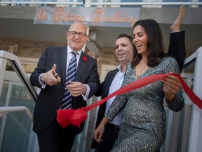 From left, Mayor Drew Dilkens, owner and developer, Ray Blanchard and his wife, Yana Sizonenko, cut the ribbon to The Bitcoin Building at 477 Pelissier Street, on Tuesday, Nov. 1, 2022.