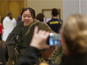 Frida Xin, 15, poses for a photo at the Canadian Armed Forces booth at Build a Dream career exploration expo on Thursday, Nov. 17, 2022.