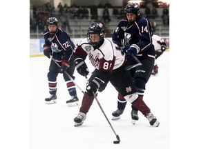 Chatham Maroons' Nick Cameron (89) is checked by LaSalle Vipers' Carson Woodall (14) in the third period at Chatham Memorial Arena in Chatham, Ont., on Sunday, Nov. 6, 2022. Mark Malone/Chatham Daily News/Postmedia Network