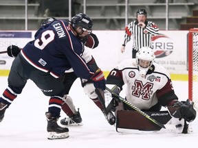 Chatham Maroons goalie Luka Dobrich makes a save on LaSalle Vipers' Jake Eaton in the third period at Chatham Memorial Arena in Chatham on Saturday.
Mark Malone/Chatham Daily News/Postmedia Network