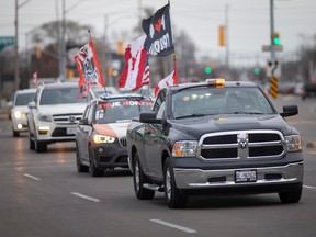 WINDSOR, ONT:. NOVEMBER 19, 2022 - A large convoy of anti-mask mandate protesters enter Windsor from Tecumseh along Tecumseh Road East, on Saturday, Nov. 19, 2022.
