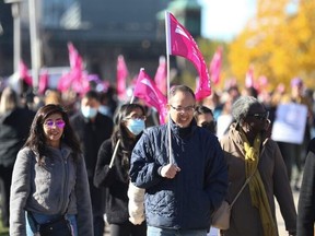 Unionized CUPE and ATU workers are pictured while protesting outside of Queens Park on Nov. 7, 2022.