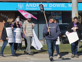 CUPE members and supporters are shown in front of MPP Andrew Dowie's constituency office in Windsor on Monday, November 7, 2022.